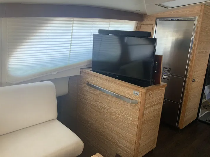 Vanquish Yacht Photos Pics Interior of 2018 Xquisite Yachts X5 with TV, sofa, and modern design.