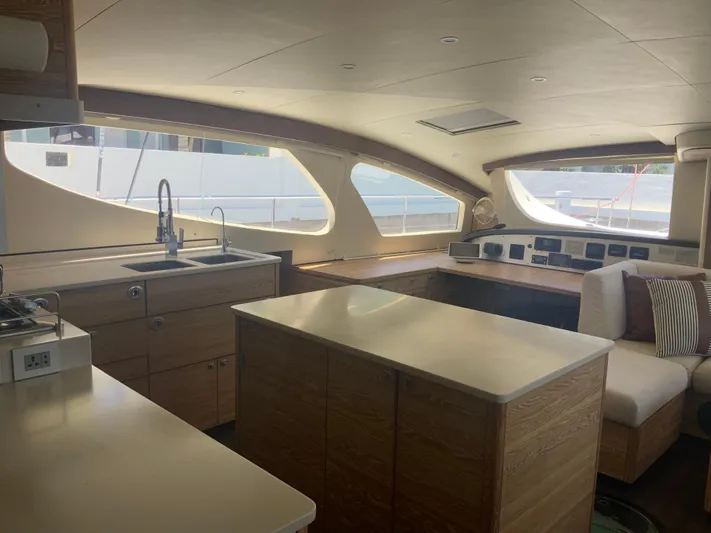 Vanquish Yacht Photos Pics Luxurious interior of 2018 Xquisite Yachts X5, featuring modern kitchen and seating area.