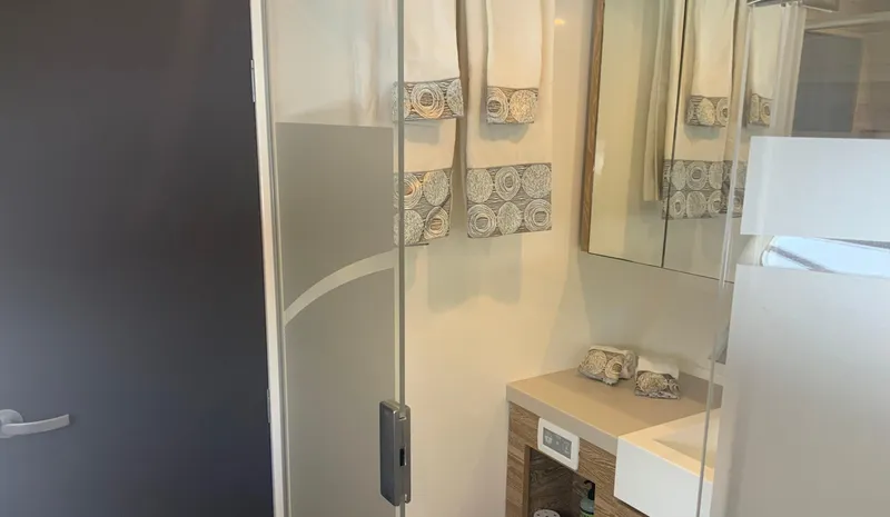 Vanquish Yacht Photos Pics Luxurious bathroom interior of 2018 Xquisite Yachts X5 with modern fixtures and elegant decor.