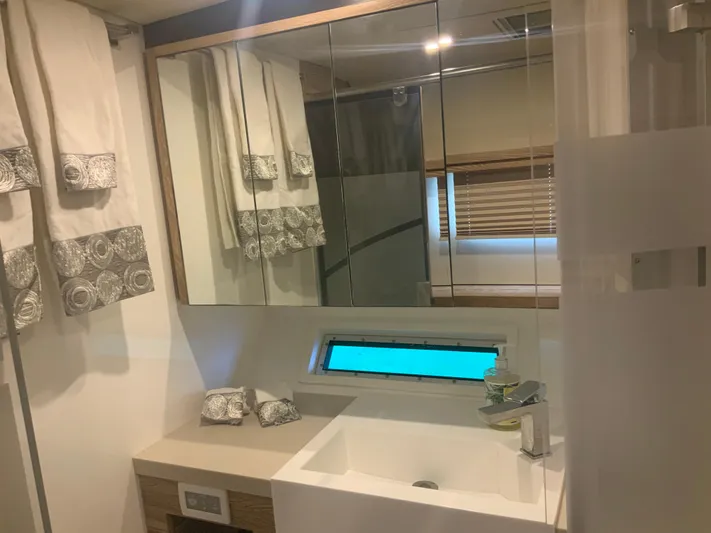 Vanquish Yacht Photos Pics Luxurious bathroom in 2018 Xquisite Yachts X5, featuring modern sink and elegant decor.