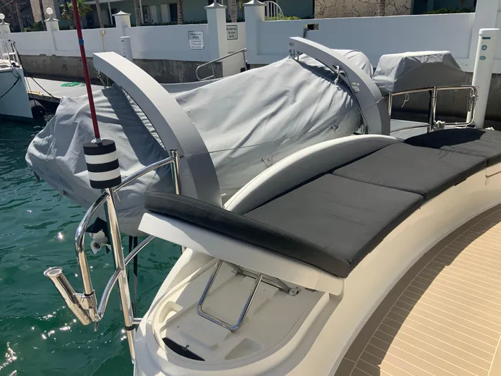 Vanquish Yacht Photos Pics 2018 Xquisite Yachts X5 with covered seating area and docked at marina.
