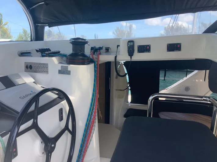 Vanquish Yacht Photos Pics Cockpit of 2018 Xquisite Yachts X5 with steering wheel and navigation equipment.