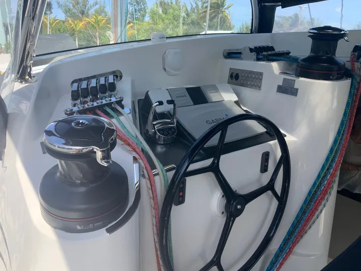 Vanquish Yacht Photos Pics Helm of 2018 Xquisite Yachts X5 with steering wheel and control panel.
