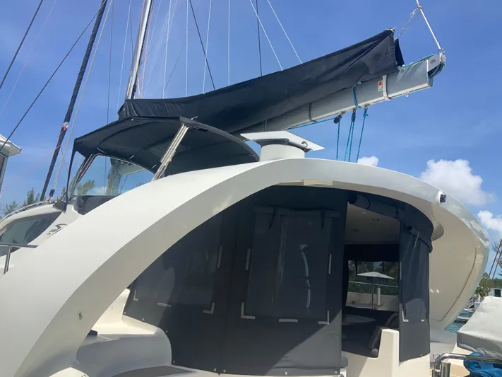 Vanquish Yacht Photos Pics 2018 Xquisite Yachts X5 sailboat with sleek design and modern features, docked under clear skies.