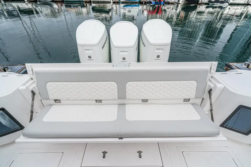 R&r 5 Yacht Photos Pics 2022 Intrepid 477 Evolution boat with triple Mercury engines and cushioned seating.