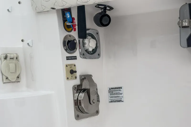 R&r 5 Yacht Photos Pics 2022 Intrepid 477 Evolution boat control panel with various switches and connectors.