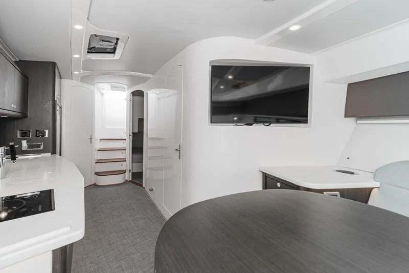 R&r 5 Yacht Photos Pics Luxurious interior of 2022 Intrepid 477 Evolution yacht with modern amenities and sleek design.