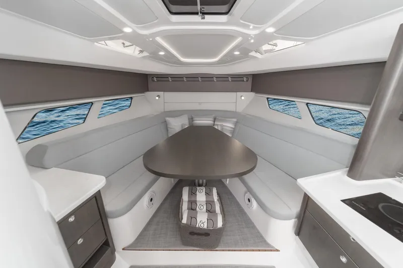 R&r 5 Yacht Photos Pics Luxurious interior of 2022 Intrepid 477 Evolution yacht with sleek seating and modern design.