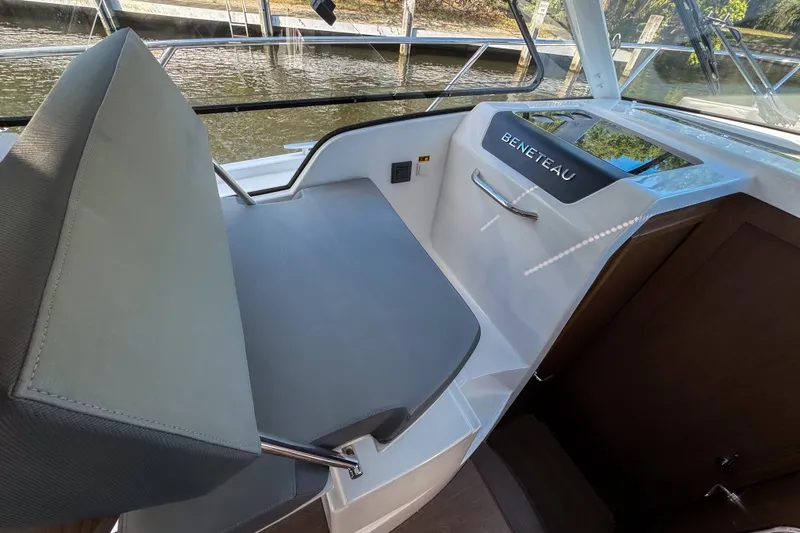  Yacht Photos Pics Interior view of 2025 Beneteau Antares 9 boat, featuring sleek seating and modern design.