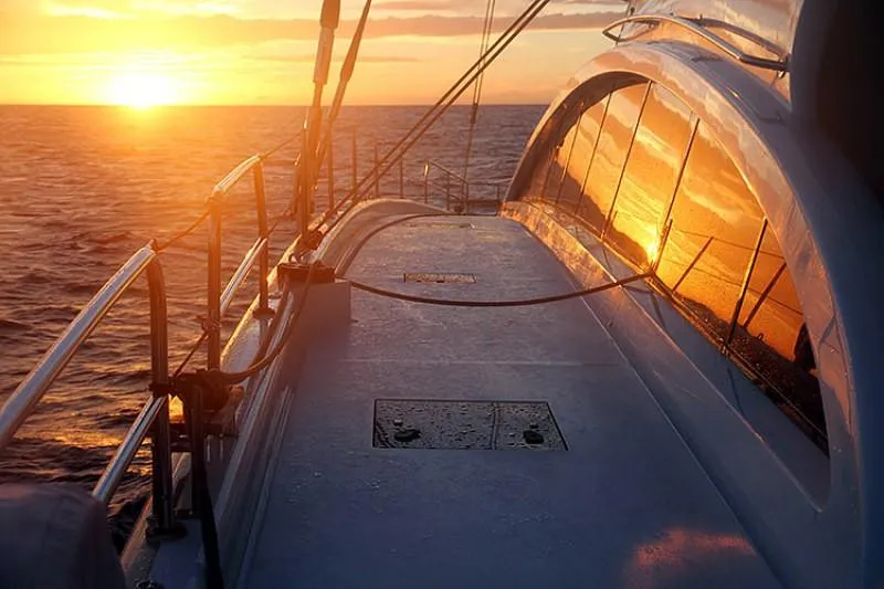 Houbara Yacht Photos Pics Sunreef 82 DD yacht at sunset, 2012 model, reflecting golden ocean views.