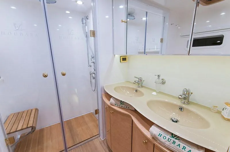 Houbara Yacht Photos Pics Luxurious bathroom in 2012 Sunreef 82 DD yacht with dual sinks and glass shower.