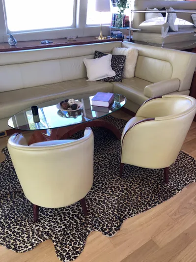 Houbara Yacht Photos Pics Luxurious Sunreef 82 DD yacht interior with cream leather seating and glass table, 2012 model.