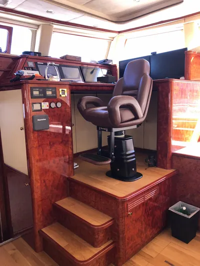 Houbara Yacht Photos Pics Luxurious helm station of 2012 Sunreef 82 DD yacht with leather captain's chair.