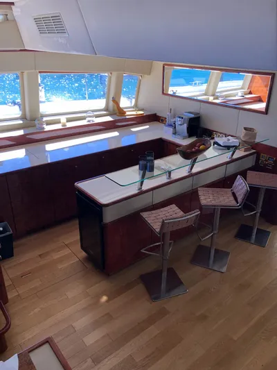 Houbara Yacht Photos Pics Luxurious interior of 2012 Sunreef 82 DD yacht with modern kitchen and ocean view.