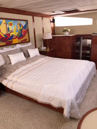 Houbara Yacht Photos Pics Luxurious bedroom interior of 2012 Sunreef 82 DD yacht with modern decor and artwork.