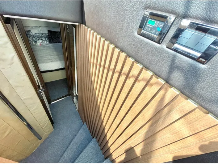 Concepcion 1641 Yacht Photos Pics Interior of 2013 Azimut 55S yacht, featuring modern wood paneling and control panels.