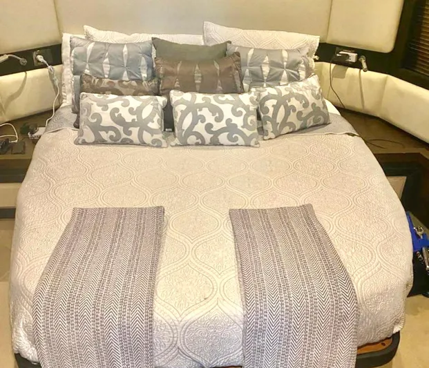 Concepcion 1641 Yacht Photos Pics Luxurious bedroom interior on a 2013 Azimut 55S yacht, featuring elegant bedding and cushions.