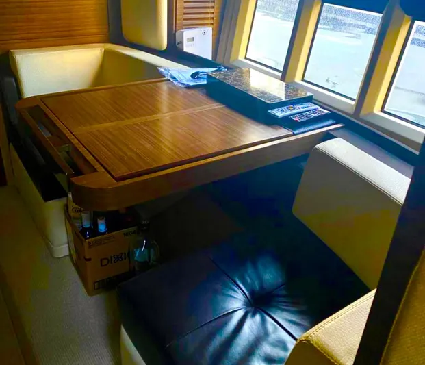 Concepcion 1641 Yacht Photos Pics Luxurious interior of 2013 Azimut 55S yacht with wooden table and leather seating.