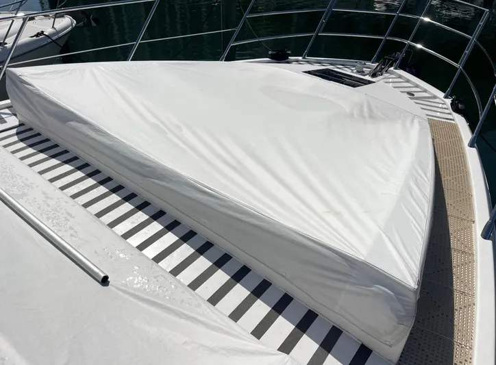 Concepcion 1641 Yacht Photos Pics Azimut 55S 2013 yacht deck with covered sunbed and striped flooring.