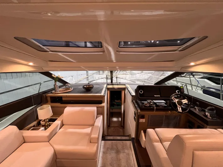  Yacht Photos Pics Luxurious interior of a 2018 Prestige 520S yacht with plush seating and modern helm.