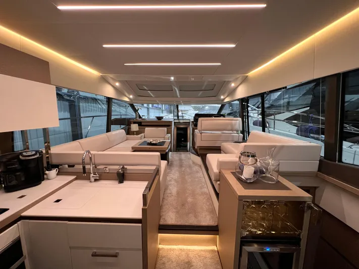  Yacht Photos Pics Luxurious interior of a 2018 Prestige 520S yacht with modern furnishings and ambient lighting.