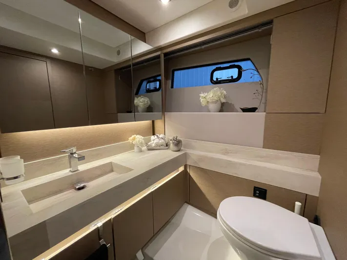  Yacht Photos Pics Luxurious bathroom interior of a 2018 Prestige 520S yacht with modern fixtures and elegant decor.