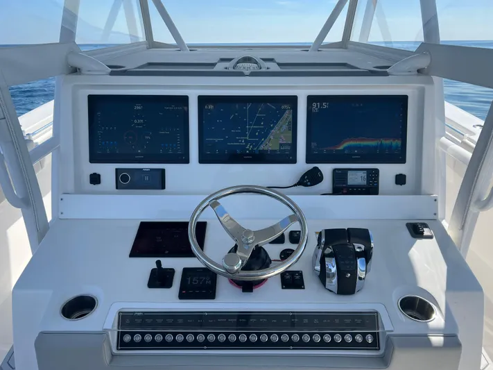  Yacht Photos Pics 2022 Invincible 42 Open Fisherman dashboard with advanced navigation and control systems.