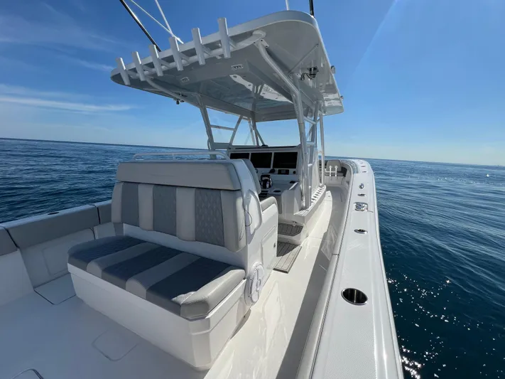  Yacht Photos Pics 2022 Invincible 42 Open Fisherman boat on open sea under clear blue sky.
