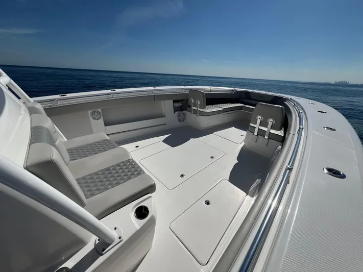  Yacht Photos Pics 2022 Invincible 42 Open Fisherman boat interior with spacious seating and ocean view.