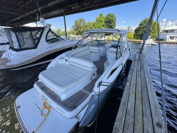  Yacht Photos Pics 2017 Cobalt R35 boat docked under a covered marina, featuring spacious seating.