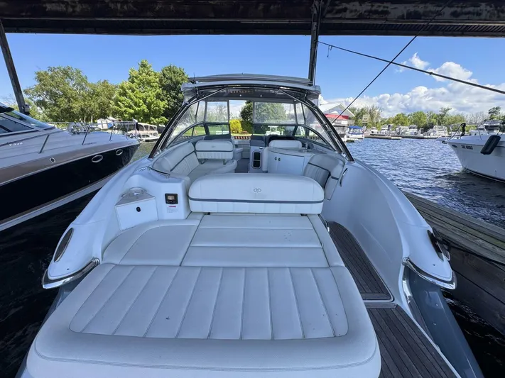  Yacht Photos Pics 2017 Cobalt R35 boat with spacious white seating, docked at a marina.