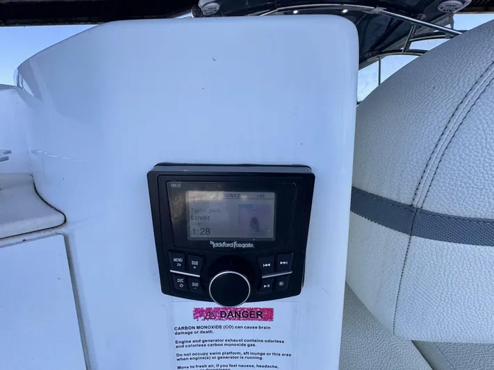  Yacht Photos Pics Boat audio system on a 2017 Cobalt R35, displaying music track information.