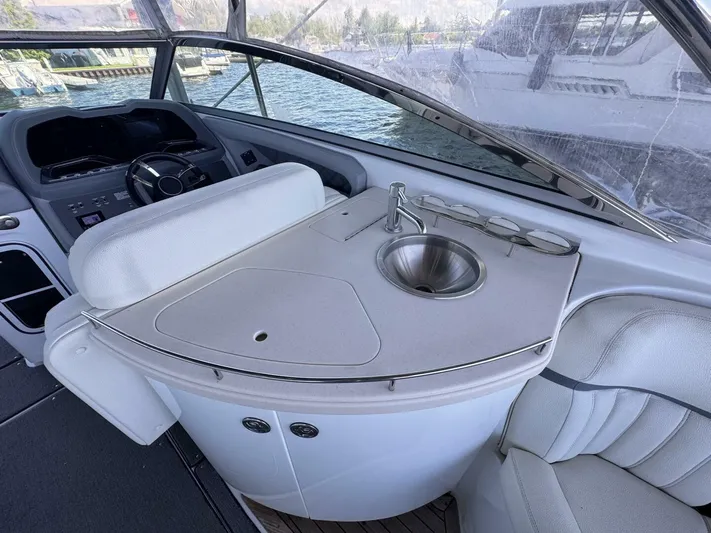  Yacht Photos Pics Interior of 2017 Cobalt R35 boat with sink and seating area.