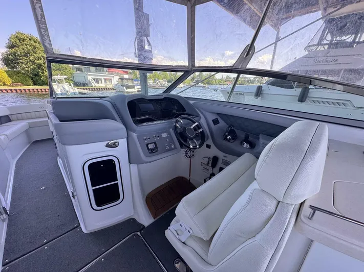  Yacht Photos Pics Interior of a 2017 Cobalt R35 boat, featuring a sleek helm and comfortable seating.