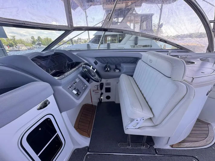  Yacht Photos Pics Interior of a 2017 Cobalt R35 boat with white seating and modern dashboard.