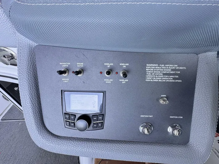  Yacht Photos Pics Control panel of a 2017 Cobalt R35 boat with switches and warning label.