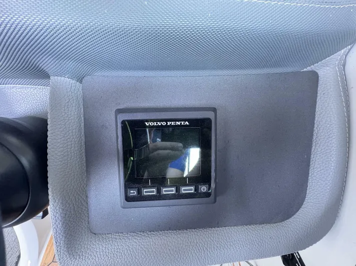  Yacht Photos Pics Volvo Penta display on 2017 Cobalt R35 dashboard, featuring control buttons.