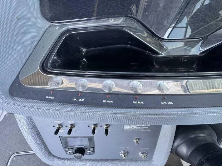  Yacht Photos Pics Control panel of a 2017 Cobalt R35 boat with various switches and dials.