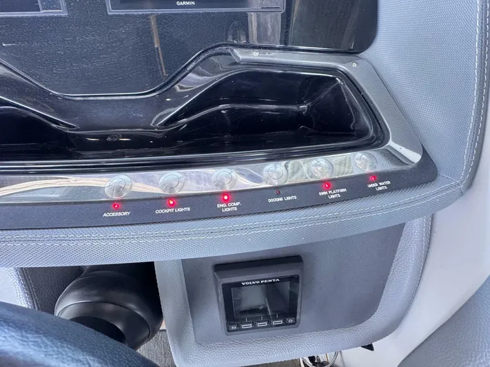  Yacht Photos Pics Control panel of a 2017 Cobalt R35 boat with labeled switches and display.