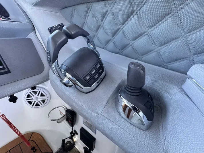  Yacht Photos Pics Control panel of a 2017 Cobalt R35 boat with joystick and throttle.