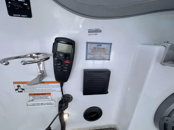  Yacht Photos Pics Control panel of a 2017 Cobalt R35 boat with radio and certification labels.