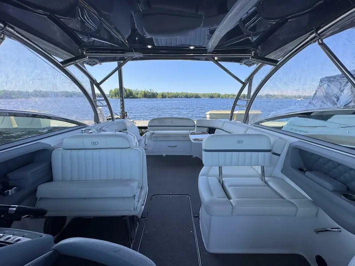  Yacht Photos Pics Luxurious interior of a 2017 Cobalt R35 boat with white seating and lake view.
