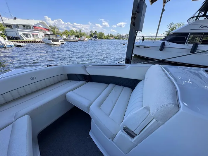  Yacht Photos Pics Luxury seating on a 2017 Cobalt R35 boat docked at a marina.