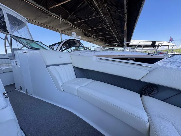  Yacht Photos Pics 2017 Cobalt R35 boat interior with white seating under a dock canopy.
