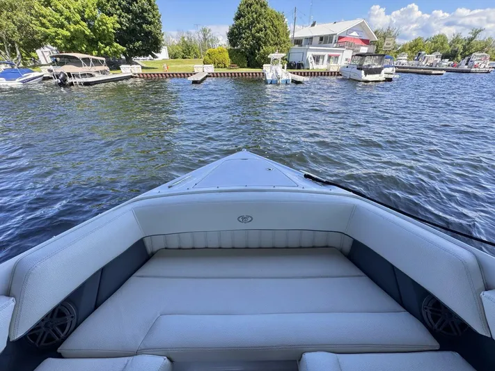  Yacht Photos Pics Bow view of 2017 Cobalt R35 boat on a sunny day at a marina.