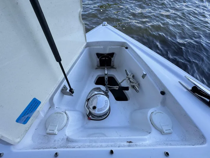  Yacht Photos Pics Anchor compartment of 2017 Cobalt R35 boat, open hatch, visible water background.
