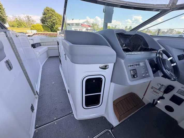  Yacht Photos Pics Interior of a 2017 Cobalt R35 boat, featuring a sleek helm and seating area.