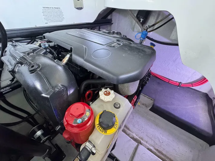  Yacht Photos Pics Engine compartment of a 2017 Cobalt R35 boat, featuring various components and labels.