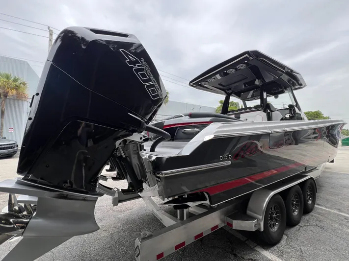  Yacht Photos Pics 2025 Nor-Tech 400 Supersport boat on trailer, featuring powerful outboard engine.