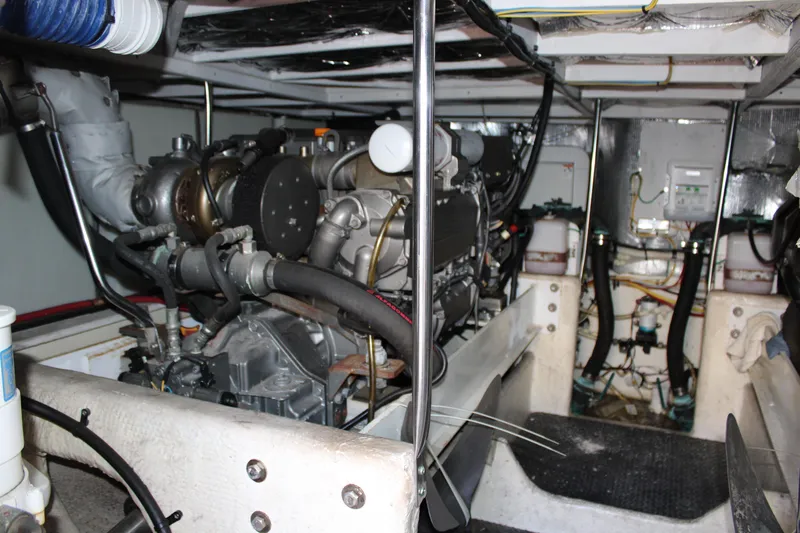 Worth The Wake Yacht Photos Pics Engine room of a 2006 Silverton 42 Convertible yacht, showcasing mechanical components.